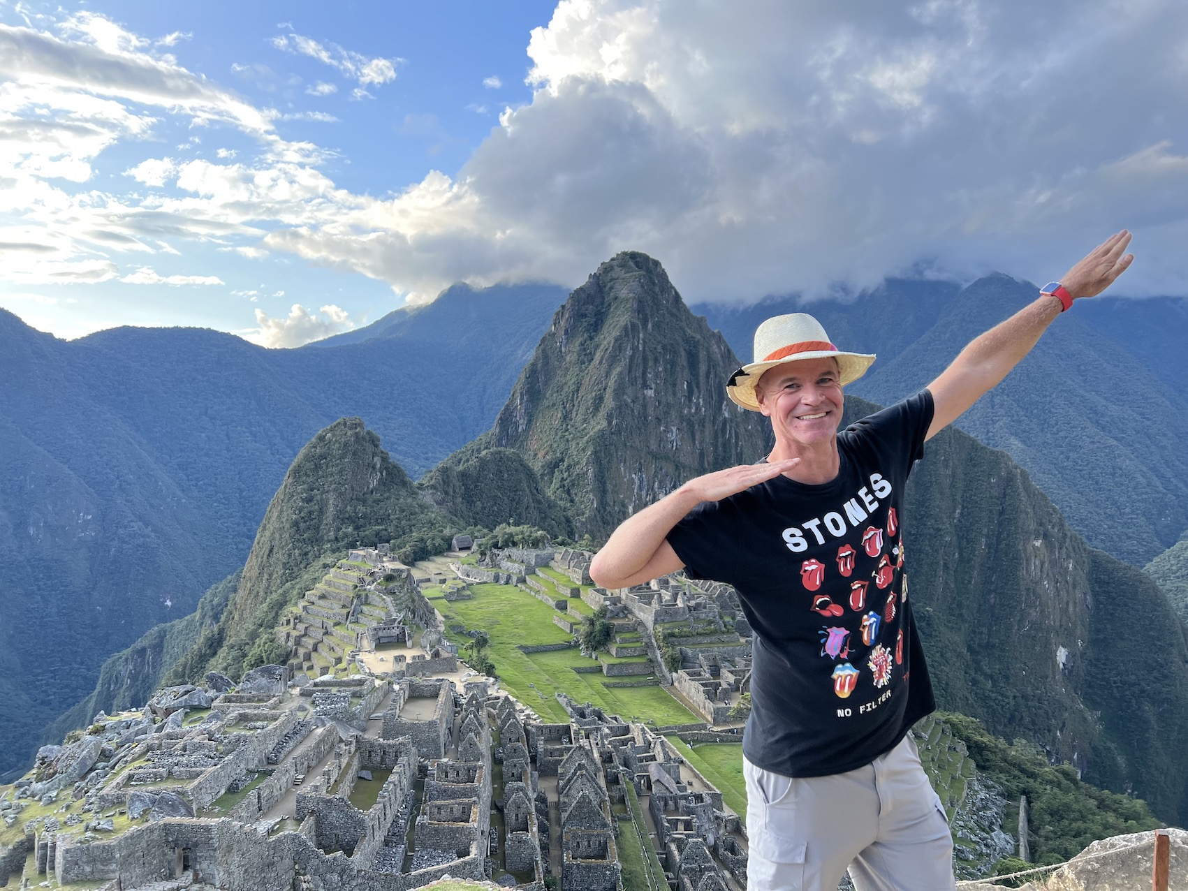 A breathtaking view of Machu Picchu, the ancient Incan city, surrounded by misty green peaks, captured after completing the iconic Inca Trail hike.